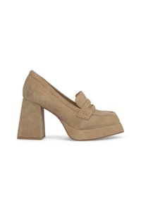 Beige suede platform loafers with a rounded toe, a decorative strap across the vamp, and a chunky square heel. Smooth texture, minimal detailing.