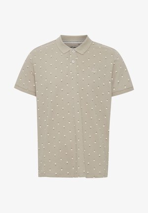 Polo shirt beige chiaro in cotone, con un motivo testurizzato di piccoli rombi bianchi e marroni. Chiusura con tre bottoni.