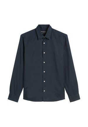 Marineblaues Langarmhemd aus Baumwolle mit einem Button-Down-Kragen, Frontleiste mit weißen Knöpfen und knöpfbaren Manschetten. Glatte Textur.