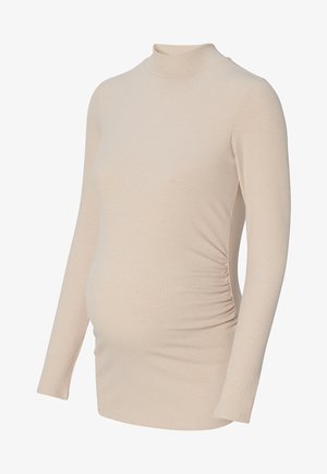 Haut de maternité beige à manches longues, côtelé, avec un col haut et des fronces latérales pour le confort du ventre.