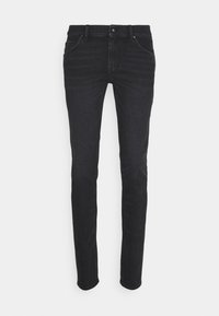 Černé džíny z denimu s úzkým střihem, standardním pětipočetním designem kapes, zapínáním na knoflík a tónovaným šitím. Hladká textura, minimální známky opotřebení.