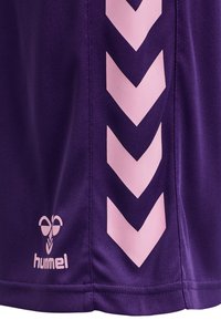 Purple athletic shirt featuring a pink chevron pattern along the side and a white logo at the bottom. Made from lightweight, breathable material.