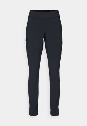 Svarte joggebukser med slim fit, elastisk midjebånd og en sidelomme med glidelås. Glatt, elastisk stoff med minimalt med sømmer.