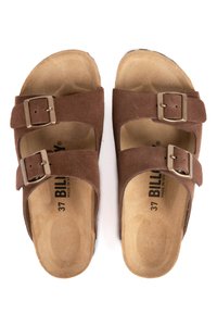 Sandales en daim marron avec deux sangles réglables dotées de boucles métalliques. Comprend une semelle intérieure douce et texturée ainsi qu'une forme anatomique. Taille 37.