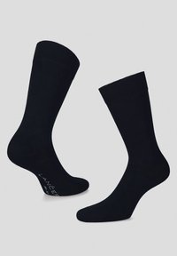 Czarne skarpetki bawełniane z prążkowanym ściągaczem, gładką fakturą oraz markowym detalem na podeszwie, zaprojektowane z myślą o komforcie i trwałości.