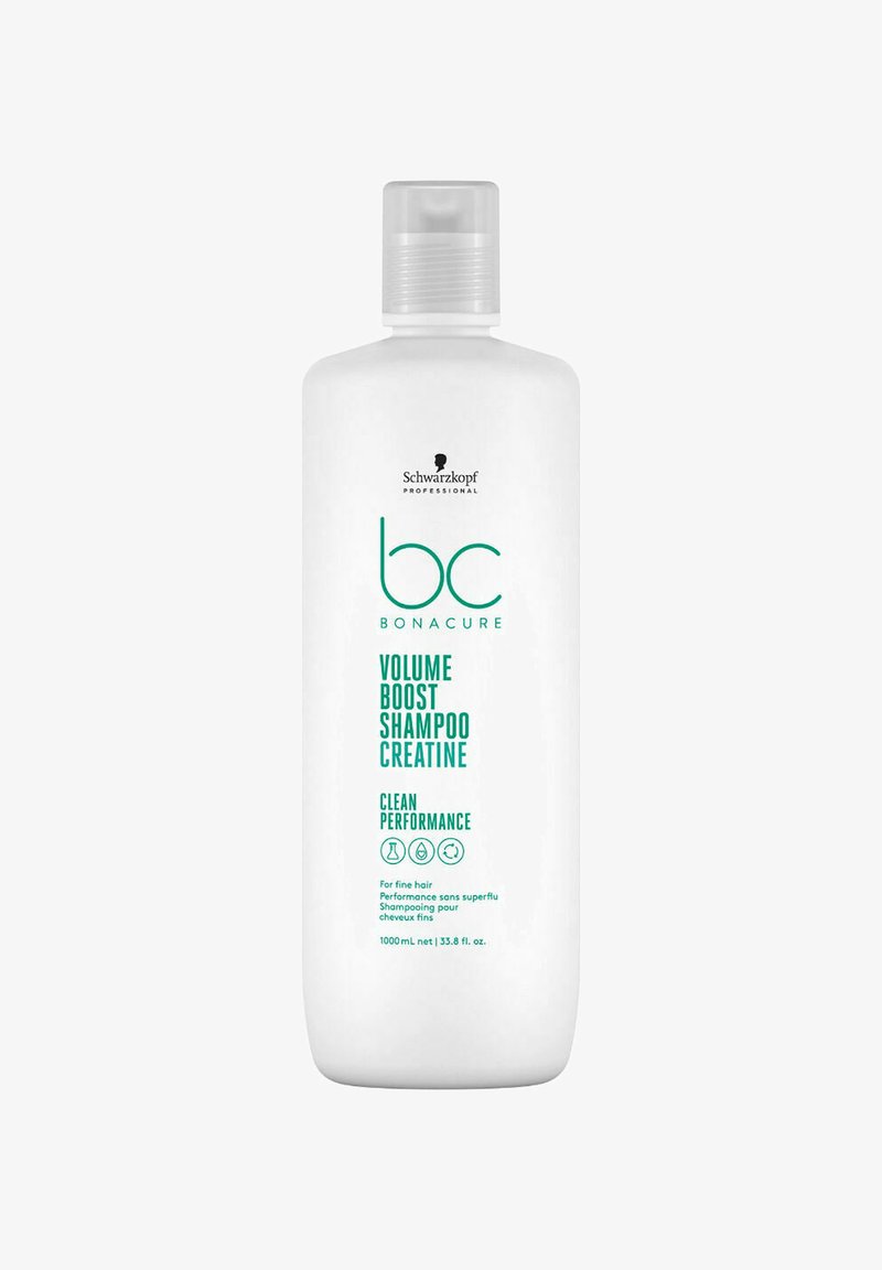 Bottiglia di shampoo in plastica bianca con pompetta, con testo verde. L'etichetta riporta "Shampoo Volume Boost Creatina" e indica 1000 mL.