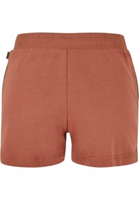 Bavlněné šortky v tlumené terakotové barvě s elastickým pasem. Charakterizují je hladký povrch, jednoduchý design a žádné další vzory nebo akcenty.
