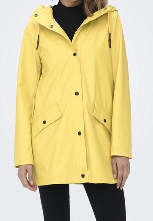 Impermeable - light yellow