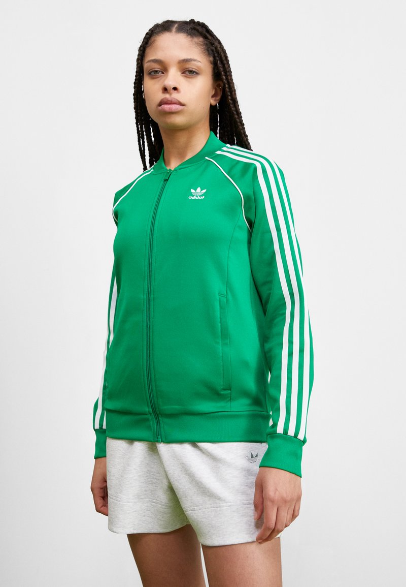 veste adidas verte et blanche