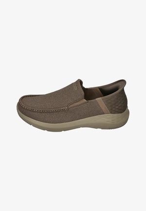 Brown slip-on shoes with a woven fabric upper, padded collar, and a textured rubber sole for grip. Features minimal stitching and branding.
