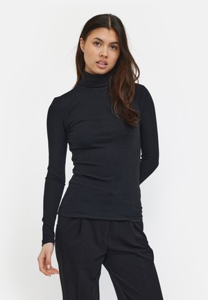 Zwarte, lang mouwen coltrui gemaakt van ribbelstof. Fit ontwerp met een gladde textuur, gecombineerd met donkere broek.