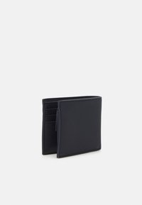 Black wallet made of textured material, featuring multiple card slots and a sleek, minimalist design. Compact and rectangular shape.
