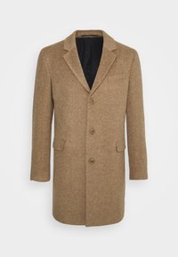 Yksirivinen camel-värinen villakangastakki, jossa on viistot lärpäkkeet, kolme nappia, etuläpäppockets ja musta vuori.