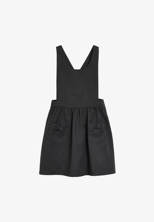 Sort ærmeløs forklædekjole med indsnævret talje og to forlommer, hver pyntet med en lille stofsløjfe.