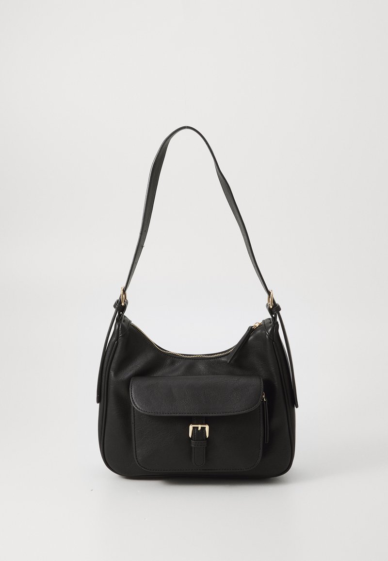 Black leather handbag with a curved shape, adjustable strap, gold hardware, zip closure, and a front pocket with a buckle detail.