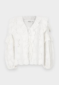 White blouse with eyelet fabric, ruffled neckline, and sleeves. Features a tie closure at the front and a textured finish.