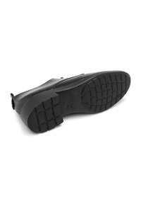 Talpă de încălțăminte din cauciuc negru, cu un model texturat pentru aderență, margini curbate și un logo ștampilat. Prezintă un design plat, potrivit pentru purtarea casual.