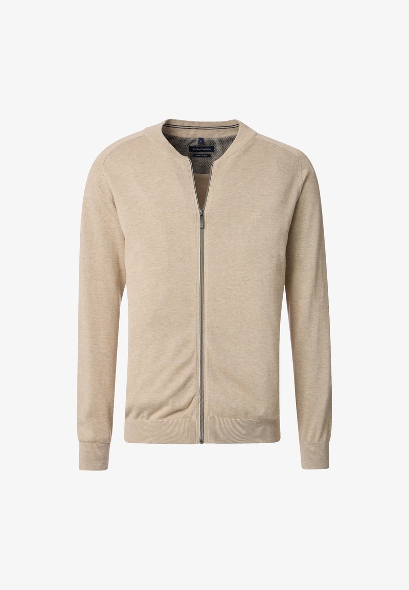Beige zip-up kofta i mjukt tyg, med rund halsringning, långa ärmar och subtila ribbade detaljer vid ärmsluten och nederkanten.