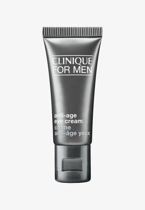 Tube gris avec un capuchon strié, étiqueté "Clinique for Men", contenant une crème pour les yeux anti-âge ; design élégant et minimal avec texte blanc.