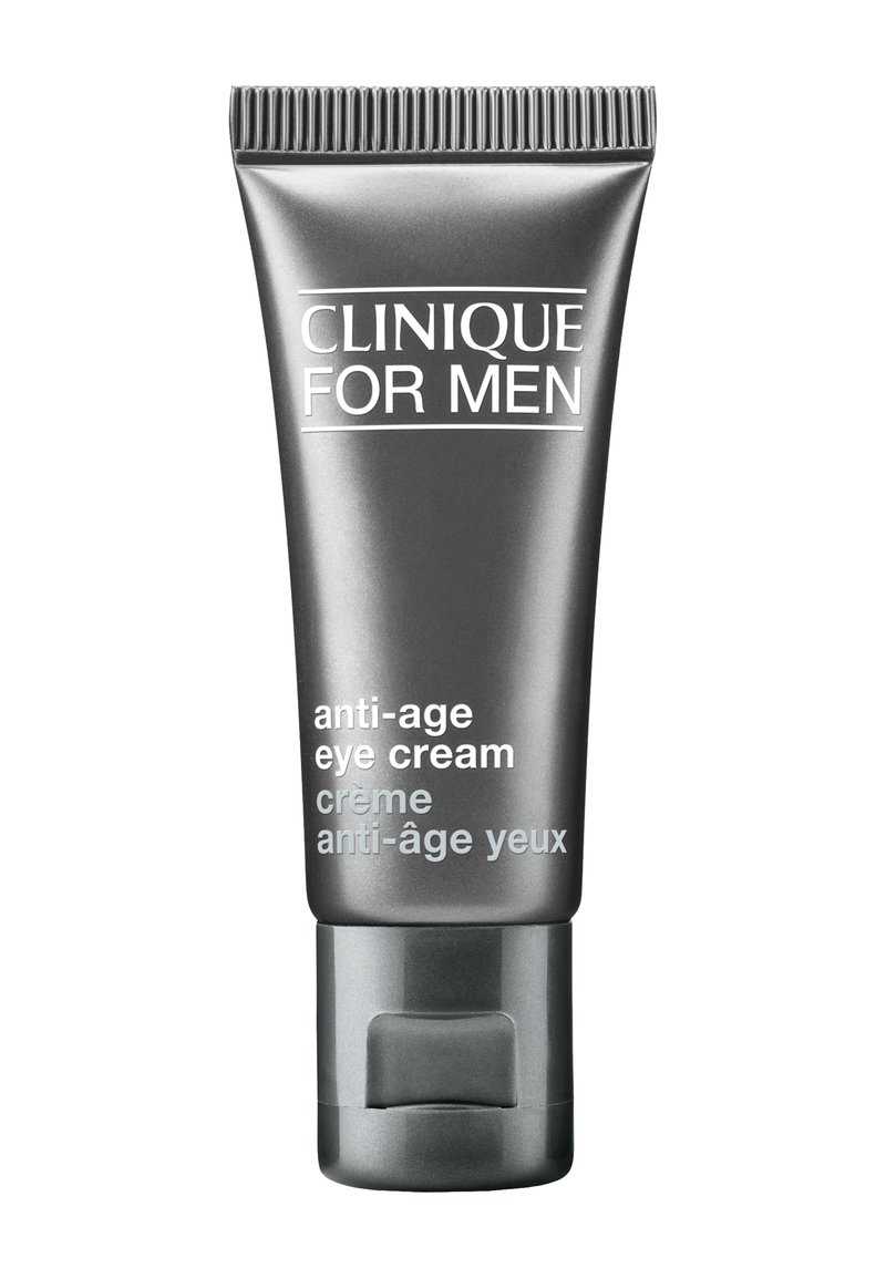 Tube gris avec un capuchon strié, étiqueté "Clinique for Men", contenant une crème pour les yeux anti-âge ; design élégant et minimal avec texte blanc.