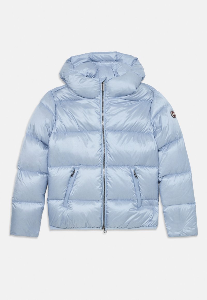 Light blue puffer jacket with high padded collar, front zipper, zippered side pockets, long sleeves, and round logo patch on the left arm.