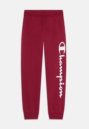 Pantalons de survêtement bordeaux en mélange de coton, dotés d'une taille à cordon de serrage, de jambes fuselées et d'un grand logo "Champion" blanc sur le côté.