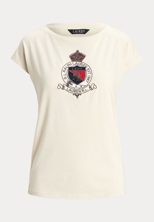 T-shirt in cotone color crema con colletto rotondo, maniche corte e stemma ricamato con dettagli in rosso, blu e argento.