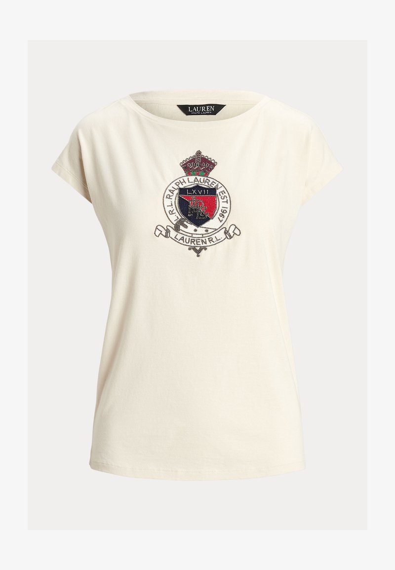 T-shirt in cotone color crema con colletto rotondo, maniche corte e stemma ricamato con dettagli in rosso, blu e argento.