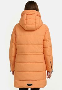 Orange padded parka with a hood, featuring horizontal stitching, side pockets with zippers, and a logo tag at the lower back.