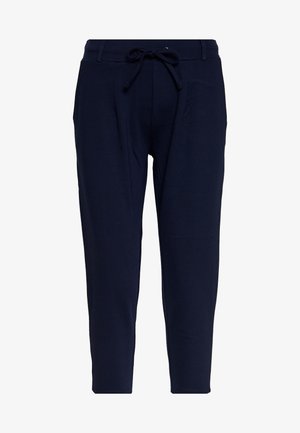 Pantalon bleu foncé fuselé avec taille élastique, cordon de serrage, passants de ceinture et poches latérales, présenté sur fond blanc.
