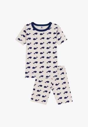 Kinder tweedelige beige pyjama set met een marineblauw walvis patroon en een marineblauwe ronde kraag op het shirt.
