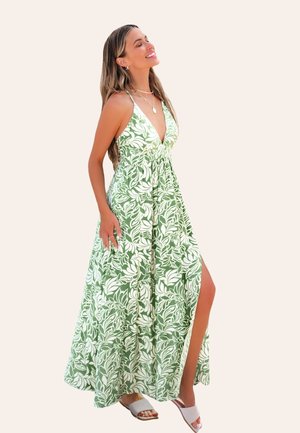 Lungo vestito verde con un motivo floreale bianco, scollatura a V e spacchi laterali. Realizzato in tessuto leggero con un design fluido.