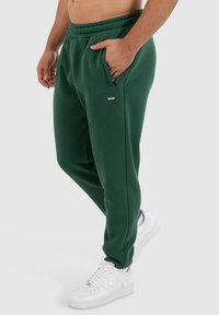 Smilodox CASUAL SPORT FIERO - Trainingsbroek - grün