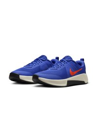 Blue athletic shoes with mesh upper, orange branding, padded collar, and black rubber sole. Features rounded toe and lace-up design.