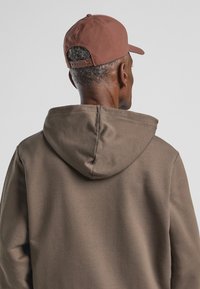 Jack Wolfskin STORM - Pet - dark rust