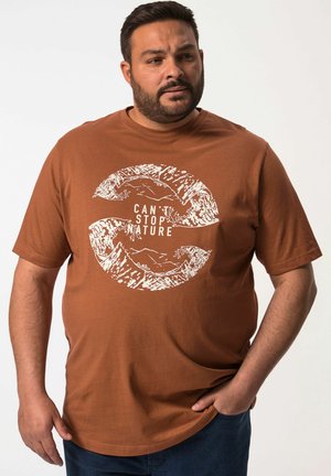 Brown cotton T-shirt with short sleeves featuring a white graphic of mountains and text "CAN'T STOP NATURE" in a circular design.