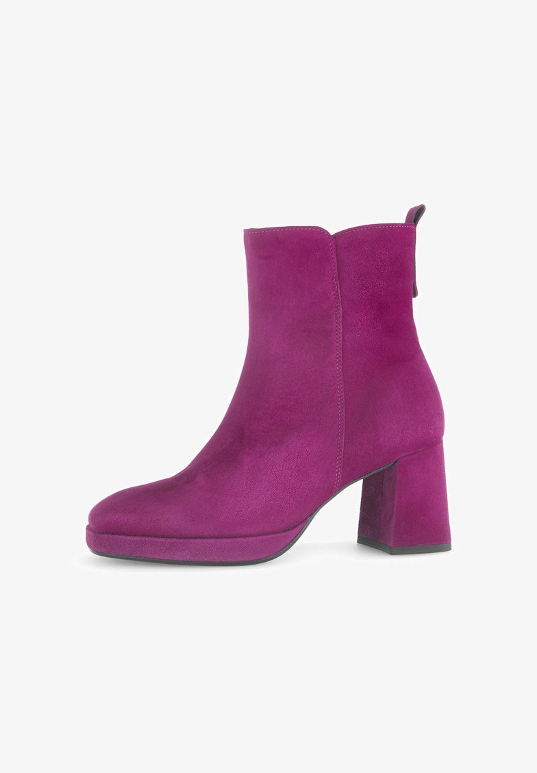 Magenta suede ankle boot with a block heel, rounded toe, and pull tab at the back. Smooth texture with visible stitching accents.