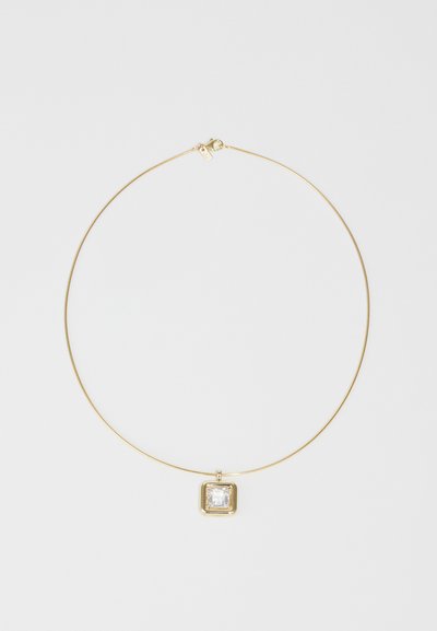 Gold necklace with a thin chain, featuring a square transparent pendant encased in a gold setting. Smooth texture and minimal design.