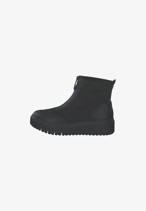 Schwarze Knöchelstiefel mit dicker, genoppter Sohle, einem Reißverschluss vorne und einer Kombination aus Wildleder und strukturiertem Leder.