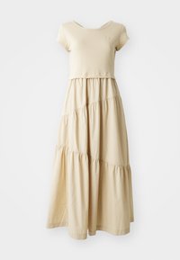 Beige jurk met een bovenkant met korte mouwen en een gelaagde, vloeiende rok met geplooide naden. Gemaakt van zachte stof met een gladde textuur.