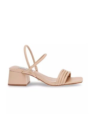 Beige heeled sandals with a block heel, featuring thin straps and three horizontal bands across the toe, smooth leather texture.
