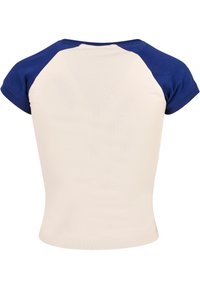 T-skjorte med korte ermer og raglan-snitt, med kremfarget kropp og marineblå ermer. Glatt bomullsstoff, tettsittende design, rund hals, ingen synlige logoer eller mønstre.