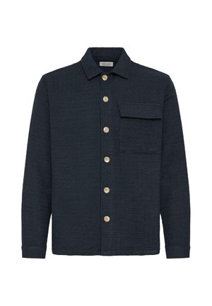 Navy textured shirt jacket made from woven fabric. Features a collar, a chest pocket, and wooden buttons down the front.