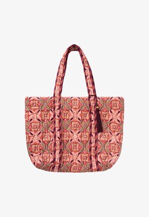 Quilted tote bag with multicolored floral and geometric pattern in shades of red, pink, green, with long handles and a tassel accent.