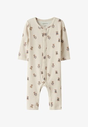 Baby-Strampler in Cremefarbe mit Rippstruktur, langen Ärmeln, vorderen Druckknöpfen und einem Teddybär-Motiv in Braun- und Blautönen.