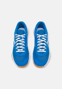 Blue athletic shoes with mesh and synthetic upper, white laces, and a rubber gum sole. Features a logo on the side.