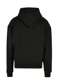 Sudadera negra con capucha y mangas largas, de corte holgado y puños acanalados. Tejido suave sin patrones ni adornos.