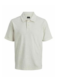 Ljusbeige polo skjorta i texturerad kvalitet. Har korta ärmar, krage och en treknapps knäppning.