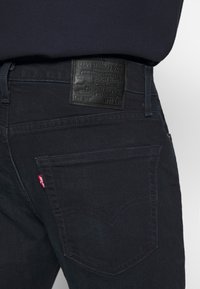 Levi's® 502 TAPER - Calças de ganga de corte afunilado - blue ridge