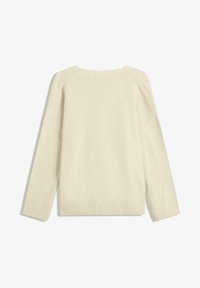 Maglione lavorato a maglia di un beige chiaro, con polsini e orlo a coste, dal taglio morbido e collo ampio. Texture soffice, design senza cuciture sul retro.